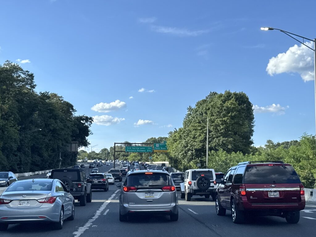 A street view in Baltimore&rsquo;s Franklin Square 21223 neighborhood, showing historic rowhouses and sidewalks, photographed by Eric T. Kirk.